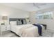 Serene bedroom showcasing a well-made bed, contemporary decor, and ample natural light from the window at 2321 Terry Ln, Sarasota, FL 34231