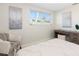 Brightly lit bedroom with a neutral color scheme, desk and comfortable chair at 2321 Terry Ln, Sarasota, FL 34231