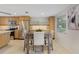 Bright and airy kitchen with stainless steel appliances, wooden cabinets, and a stylish dining table at 2321 Terry Ln, Sarasota, FL 34231