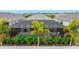 Screened pool and patio with lush landscaping at 2582 Wild Cherry Path, Sarasota, FL 34240