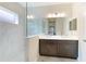 Elegant bathroom with double vanity, marble shower, and modern fixtures at 2582 Wild Cherry Path, Sarasota, FL 34240