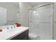 Clean bathroom with single vanity, shower, and modern fixtures at 2582 Wild Cherry Path, Sarasota, FL 34240