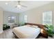 Spacious bedroom with large bed, modern dresser, and plenty of natural light at 2582 Wild Cherry Path, Sarasota, FL 34240