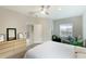 Bright bedroom with king-size bed, ensuite bathroom access, and large windows at 2582 Wild Cherry Path, Sarasota, FL 34240