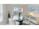 Breakfast nook with glass table and modern sideboard at 2582 Wild Cherry Path, Sarasota, FL 34240