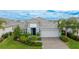 Beautiful home with gray roof and landscaping at 2582 Wild Cherry Path, Sarasota, FL 34240