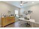 Functional home office with wood dresser and desk at 2582 Wild Cherry Path, Sarasota, FL 34240