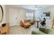 Bright home office with leather couch and standing desk at 2582 Wild Cherry Path, Sarasota, FL 34240