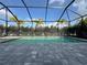 Relaxing screened pool with gray pavers at 2582 Wild Cherry Path, Sarasota, FL 34240