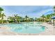 Resort-style pool with plenty of lounge chairs and a splash pad at 2582 Wild Cherry Path, Sarasota, FL 34240