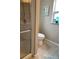 Bathroom with shower, toilet, and teal accents at 2601 Gulf N Dr # 427, Bradenton Beach, FL 34217