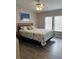 Guest bedroom with queen-size bed and light wood flooring at 2601 Gulf N Dr # 427, Bradenton Beach, FL 34217