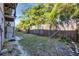 Small backyard with wooden fence and grassy area at 3101 Bee Ridge Rd # 118, Sarasota, FL 34239