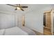 Bedroom featuring hardwood floors with a glimpse of the bathroom with stylish design at 3302 21St Avenue W Dr, Bradenton, FL 34205