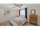 Cozy bedroom with wood floors, vintage dresser, and curtains providing a private retreat at 3302 21St Avenue W Dr, Bradenton, FL 34205