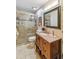 Updated bathroom with walk-in shower and modern vanity at 3368 Ramblewood Pl # 37D1, Sarasota, FL 34237