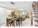 Open concept dining area with table and chairs, adjacent to living room and kitchen at 3368 Ramblewood Pl # 37D1, Sarasota, FL 34237