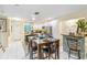 Kitchen and dining area view, modern and bright at 3368 Ramblewood Pl # 37D1, Sarasota, FL 34237