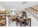 Bright dining area with table and chairs, adjacent to living room and kitchen at 3368 Ramblewood Pl # 37D1, Sarasota, FL 34237