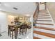 Dining area with hardwood floors and staircase at 3368 Ramblewood Pl # 37D1, Sarasota, FL 34237