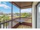 Screened balcony overlooks a tranquil canal and lush landscape at 3368 Ramblewood Pl # 37D1, Sarasota, FL 34237