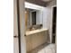 The bathroom has a double vanity, mirrors, and wallpaper at 3622 Bonaventure Ct, Sarasota, FL 34243