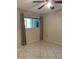 Bright bedroom with tile floors and large window offering natural light at 3622 Bonaventure Ct, Sarasota, FL 34243