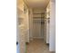 View of the walk-in closet with custom shelving and clothing racks at 3622 Bonaventure Ct, Sarasota, FL 34243