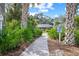 Paver path leading to the Villas of Cedar Creek, surrounded by lush greenery at 3622 Bonaventure Ct, Sarasota, FL 34243