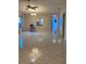 This living room features tile floors, a ceiling fan, and natural light at 3622 Bonaventure Ct, Sarasota, FL 34243