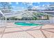 Screened pool area with lounge chairs and brick pavers around the pool at 3622 Bonaventure Ct, Sarasota, FL 34243