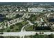 Aerial view of community with houses, lakes, and roads at 4007 Overture Cir, Bradenton, FL 34209