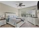 Spacious bedroom with large window and ceiling fan at 4007 Overture Cir, Bradenton, FL 34209