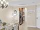 Bright dining room with chandelier and view into kitchen at 4007 Overture Cir, Bradenton, FL 34209