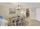 Spacious dining area with a farmhouse table and view of the kitchen at 4007 Overture Cir, Bradenton, FL 34209