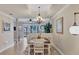 Elegant dining room features a chandelier and large windows at 4007 Overture Cir, Bradenton, FL 34209