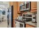 Stainless steel appliances and granite countertops in kitchen at 4007 Overture Cir, Bradenton, FL 34209