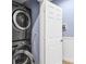 Stackable washer and dryer in a compact laundry room at 4007 Overture Cir, Bradenton, FL 34209