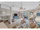 Open-concept living room with a view of the patio and staircase at 4007 Overture Cir, Bradenton, FL 34209