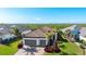 Two-story home with a tile roof, two-car garage and lush landscaping at 413 Wildlife Gln, Bradenton, FL 34209