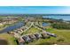 Aerial view showcasing a neighborhood of luxury homes near the water at 413 Wildlife Gln, Bradenton, FL 34209