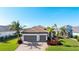 Single-story home with a two-car garage and nicely landscaped yard at 413 Wildlife Gln, Bradenton, FL 34209