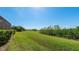 Large grassy backyard with preserve views at 413 Wildlife Gln, Bradenton, FL 34209