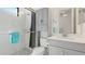 Clean bathroom with a shower/tub combo, vanity, and linen cabinet at 413 Wildlife Gln, Bradenton, FL 34209