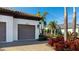 Side view of the house showing the garage and landscaping at 413 Wildlife Gln, Bradenton, FL 34209