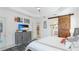 Main bedroom with a barn door separating it from the en-suite bathroom at 413 Wildlife Gln, Bradenton, FL 34209