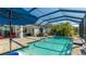 Relaxing screened pool and spa with patio furniture at 413 Wildlife Gln, Bradenton, FL 34209