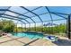 Inviting screened pool area with patio furniture at 413 Wildlife Gln, Bradenton, FL 34209