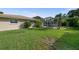 Large backyard with grassy lawn and view of the pool at 416 Giovanni Dr, Nokomis, FL 34275