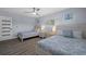 Guest bedroom with two beds, light wood furniture, and beach decor at 416 Giovanni Dr, Nokomis, FL 34275